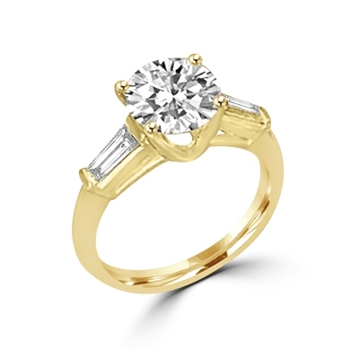 14K Solid Gold Diamond Essence engagement ring. 1.0 ct.round brilliant stones and delicate baguette on each side. 1.25 cts.t.w. Perfect for the occassion.