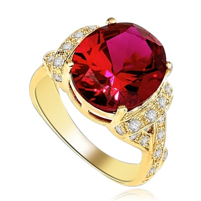 Ruby Ring- 6.0 Cts Oval Cut Ruby Essence in center accompanied by Melee on the band making criss cross design. 6.50 Cts. T.W. set in 14K Solid Yellow Gold.