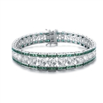 A stunner, this Platinum Plated Sterling Silver 7.25" bracelet features graduating round brilliant stones, emerald baguettes at the top and the bottom. 30.0 cts. t.w.