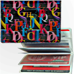 Lenticular credit card ID holder with rainbow alphabet letters on black background, depth