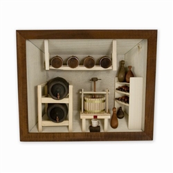 Poland has a long history of craftsmen working with wood in southern Poland. Their workshops produce beautiful hand made boxes, plates and carvings.  This shadow box is a look inside a traditional winery