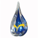 Four-sided art glass paperweight, with a cobalt-blue interior core, surrounded by a yellow ribbon and a few bubbles, in a classic teardrop shape. Each piece is hand blown and hand finished in Poland. Made with the highest quality craftsmanship and hand-si