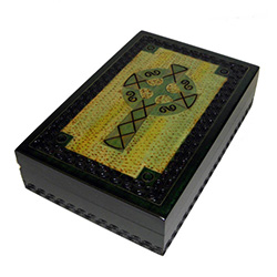 This Irish green box has hand carved cross design with a detailed border around the lid and the sides of the box. Metal inlay accents the lid border and cross pattern.