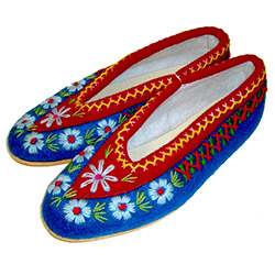 These Polish highland slippers are made from wool and are hand made and stitched. They are very comfortable, lightweight and feature cushy rubber like soles. Intended primarily as for indoor use.  They come in a variety of two-tone colors and while we