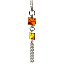 Two squares of amber suspended on a fine silver chain.
