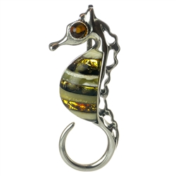 Artistic use of silver and amber to create this colorful seahorse pendant.