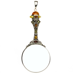 Unique and beautifully hand-crafted sterling silver magnifying glass decorated with amber highlights. Has its own silver finding which can be used to attach a chain if desired. Size is approx 4.75" x 2".