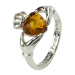 Claddagh design sterling silver ring with an amber center piece.  Engraved on the inside band is: Love Loyalty Friendship.  Ring size front is approx 0.75" x ..5"
