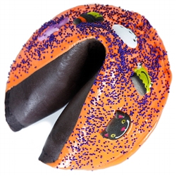 Black Raspberry Giant fortune cookie dipped in orange colored chocolate with spooky critters and purple sprinkles.