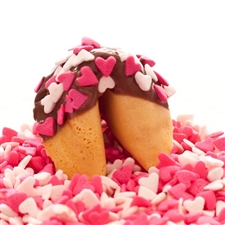Traditional vanilla fortune cookies covered in chocolate with pink and white heart candy sprinkles! Each fortune cookie comes with your custom sayings inside.