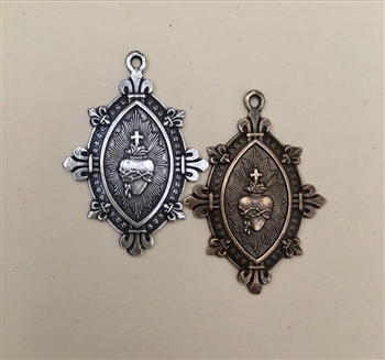 Sacred Heart With Fleur De Lis And Etched Details, Marquis Shaped1-1/4" Medal - Catholic religious medals in authentic antique and vintage styles with amazing detail. Large collection of heirloom pieces made by hand in California, US. Available in true br