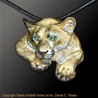 Cougar Pendant "Shadow Cat" by wildlife artist jeweler Daniel C. Toledo, Toledo Wildlife Works of Art.  Rhodium and 22k gold plated over sterling silver, black enamel, peridot eyes.  Limited edition of 250